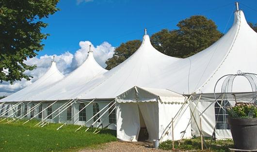 a line of sleek and modern porta potties ready for use at an upscale corporate event in Homedale